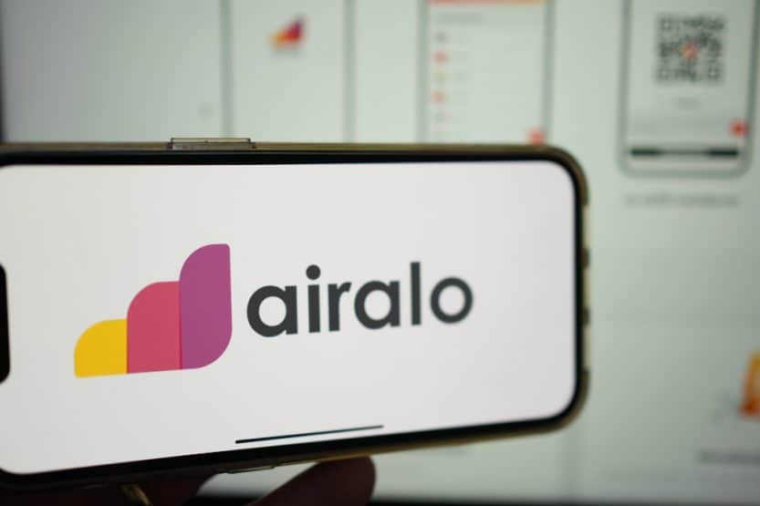 What is Airalo? Here is a view of airalo company logo on a handheld cell phone.
