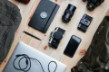 Photo of travel gear laid out on the floor.